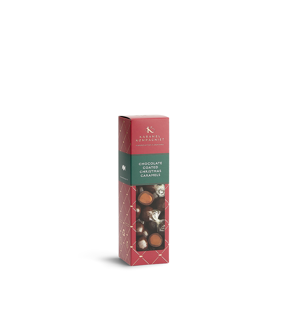 Chokoladeovertrukne Julekaramel Kugler i en æske fra Karamel Kompagniet stående