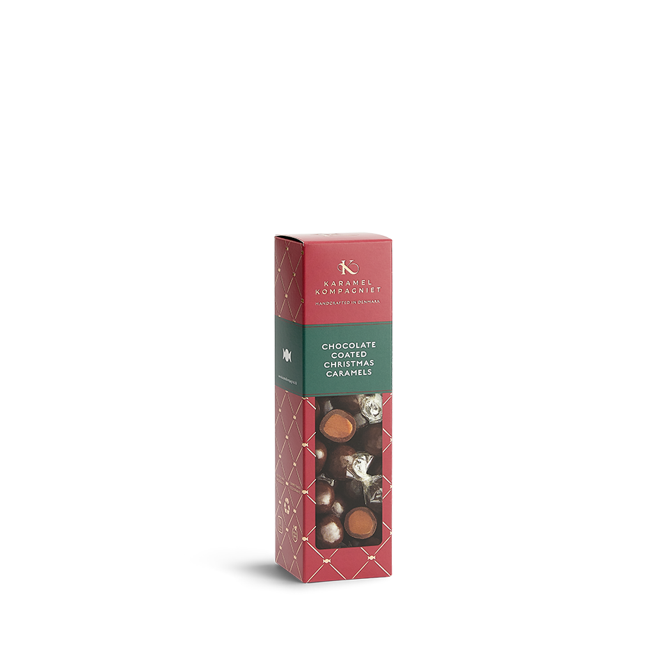 Chokoladeovertrukne Julekaramel Kugler i en æske fra Karamel Kompagniet stående