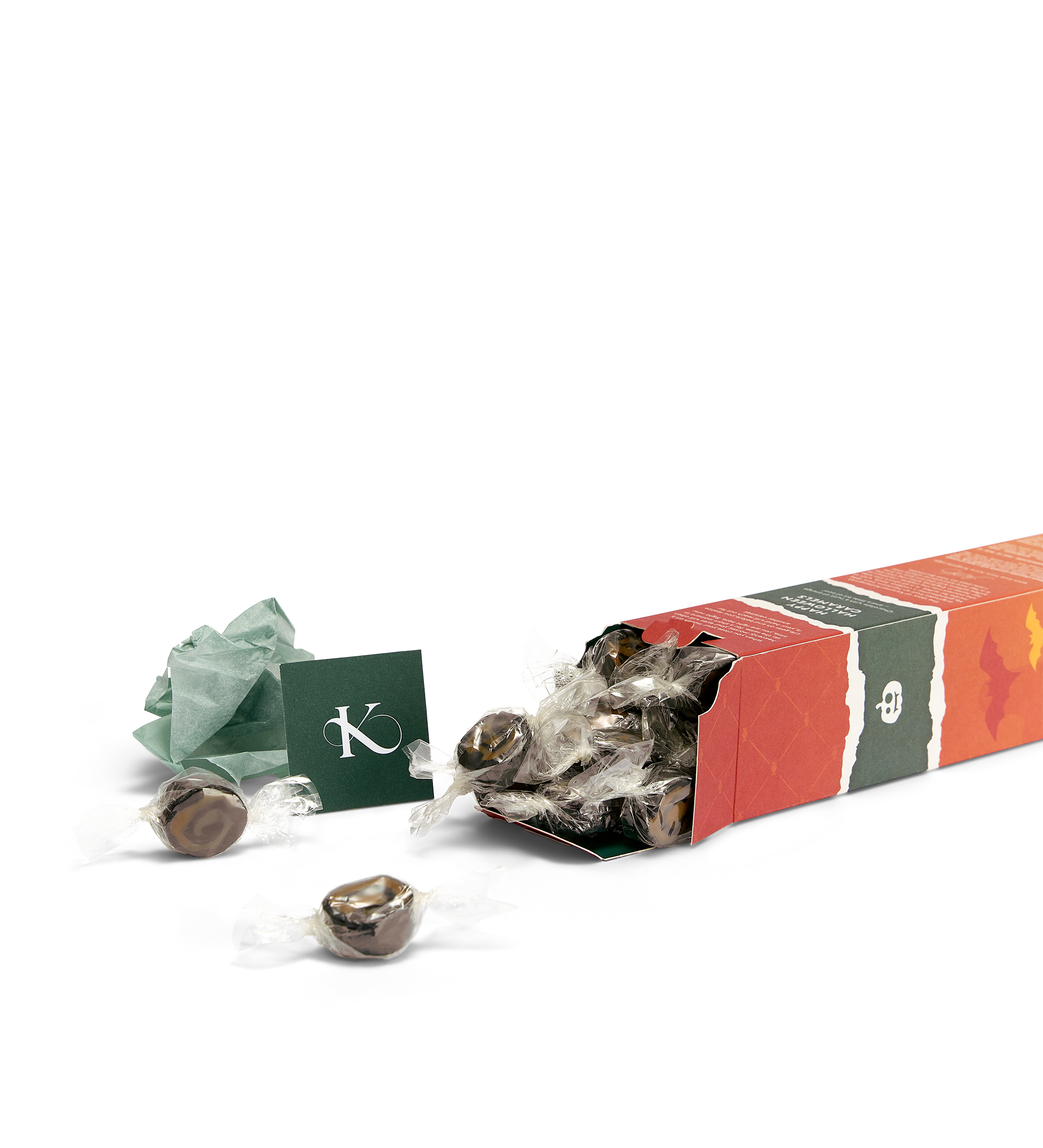 Chokolade- og appelsinkarameller - Happy Halloween H æske der ligger ned med karameller flydende ud