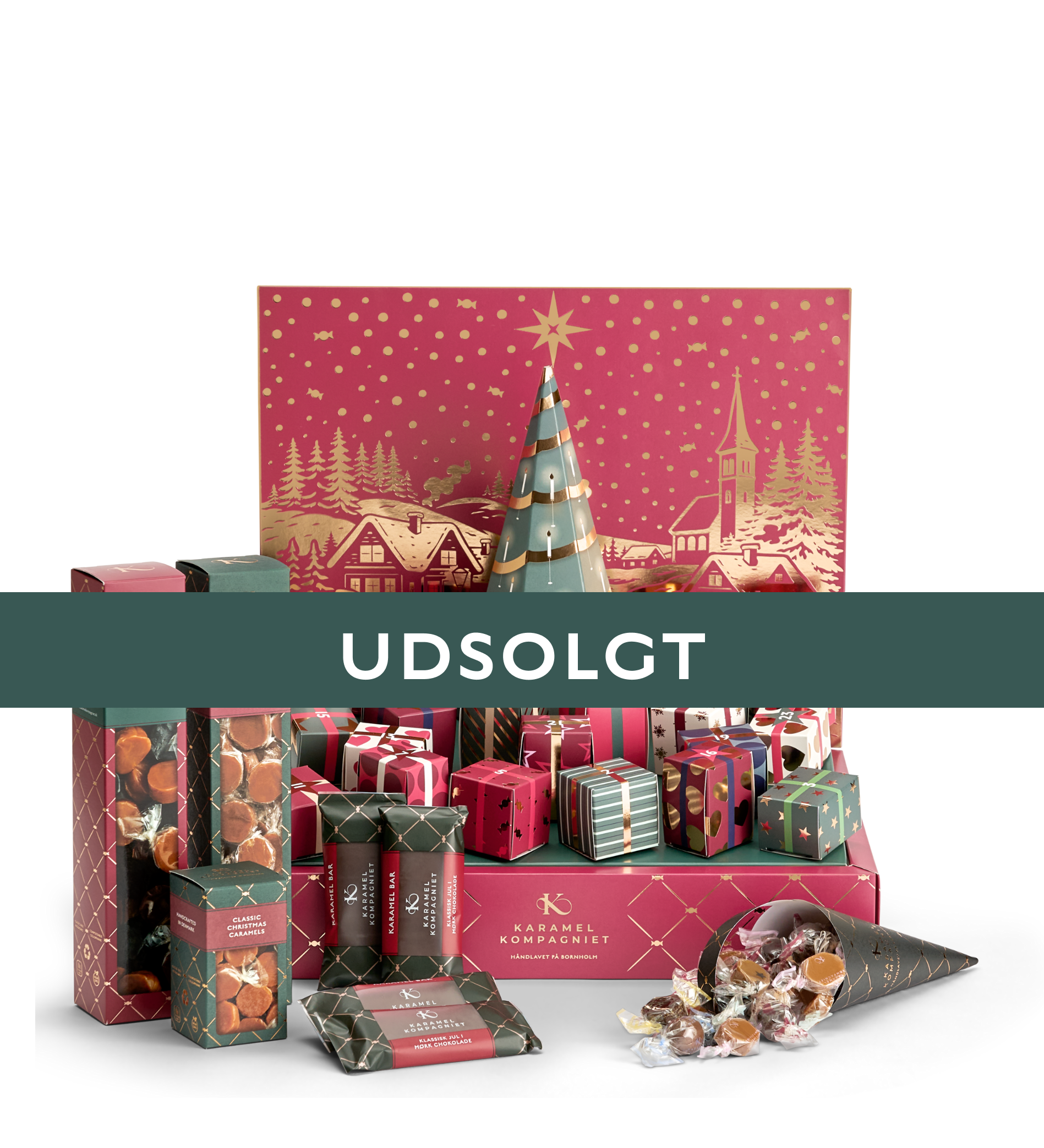 Karamel Kompagniets julekalender 2026 med julekalenderen, en æske merry christmas caramels, en lille æske flødekarameller, fire karamelbarer med julekarameller og en gratis gave, en klassik jul æske karameller og et bånd med UDSOLGT henover billedet